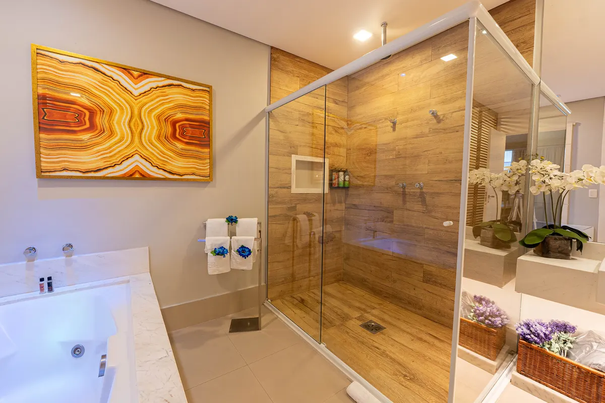 Heritage Suite bathroom, with a bathtub and glass shower