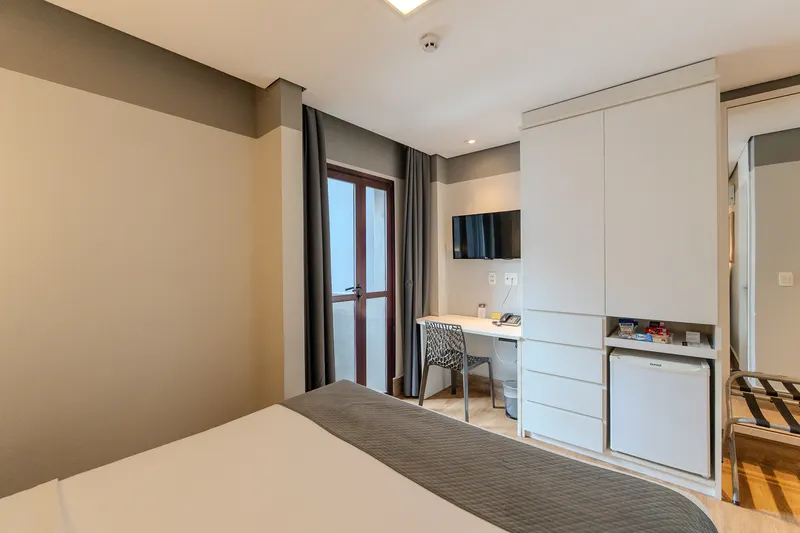 Standard Double, unit with balcony: glass door to the balcony next to the desk